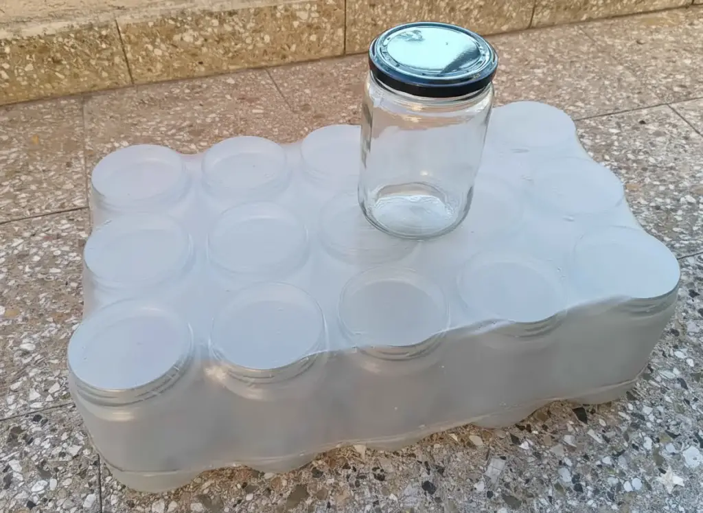 Frasco de vidrio con tapa metálica negra Estrella 660